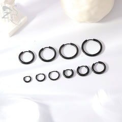 black Huggie hoop earrings